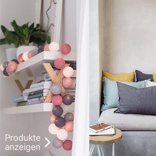 farbige Lampion-Lichterkette mit gemütlichem Sofa 